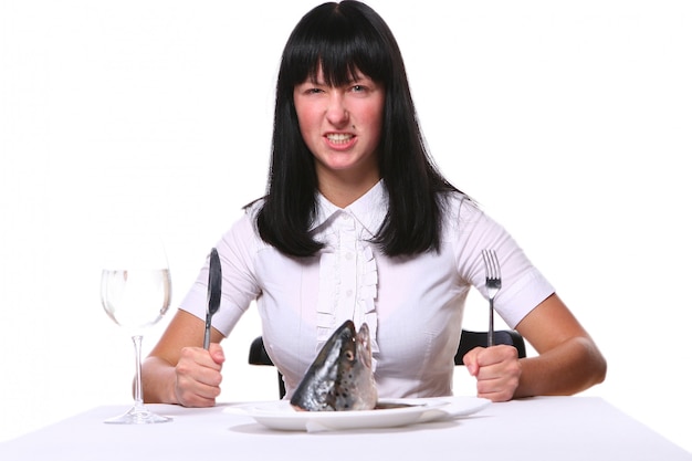 Beautiful woman eating fresh fish