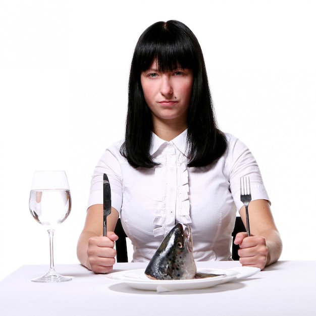 Beautiful woman eating fresh fish