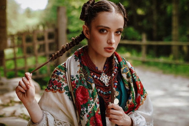 Free photo beautiful woman in an embroidered traditional dress