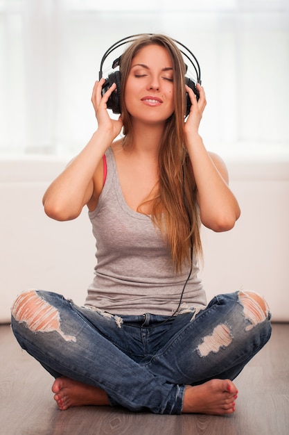 Beautiful woman enjoy music in headphones