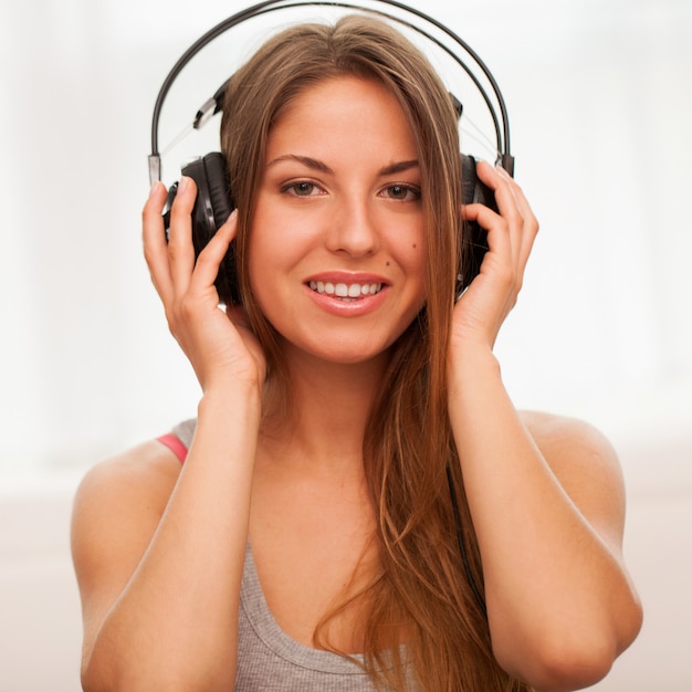 Beautiful woman enjoy music in headphones 