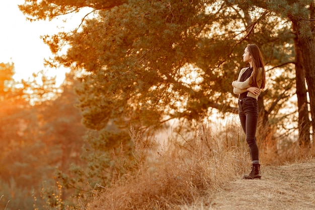 Beautiful woman enjoying the nature with copy space