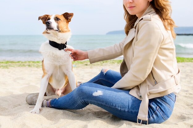 Beautiful woman enjoying time outdoors with her dog