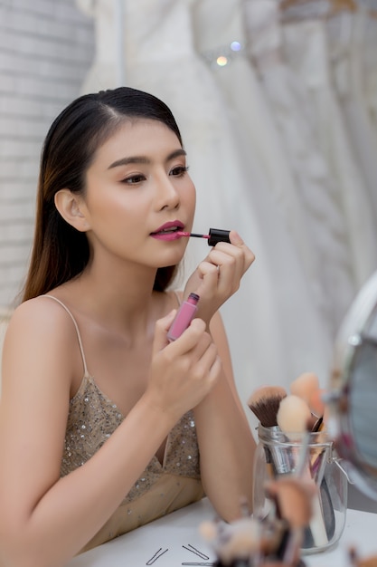 Beautiful woman face and hand of make-up