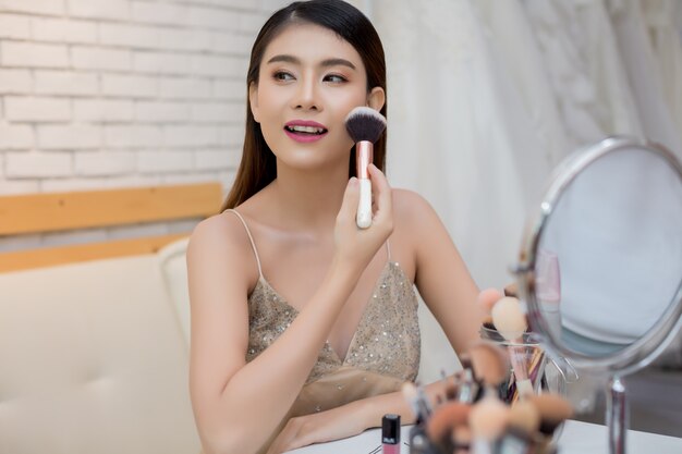 Beautiful woman face and hand of make-up