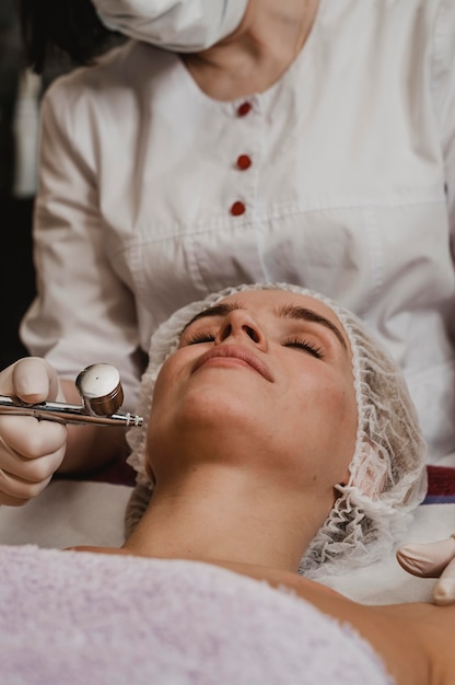 Beautiful woman getting a cosmetic treatment