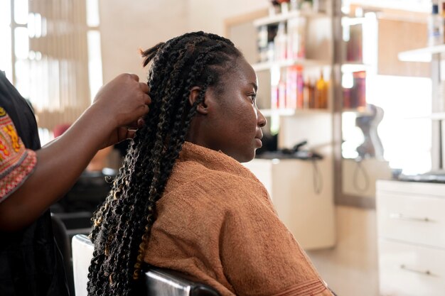 Beautiful woman getting her hair done at the beauty salon