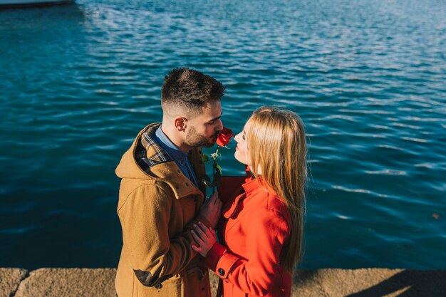 Beautiful woman getting rose on date