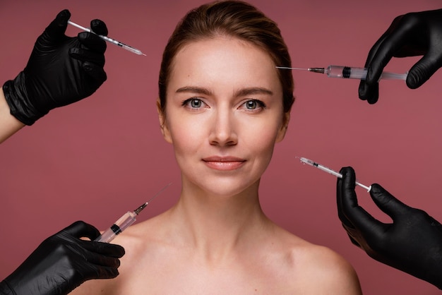 Free photo beautiful woman having her face injected