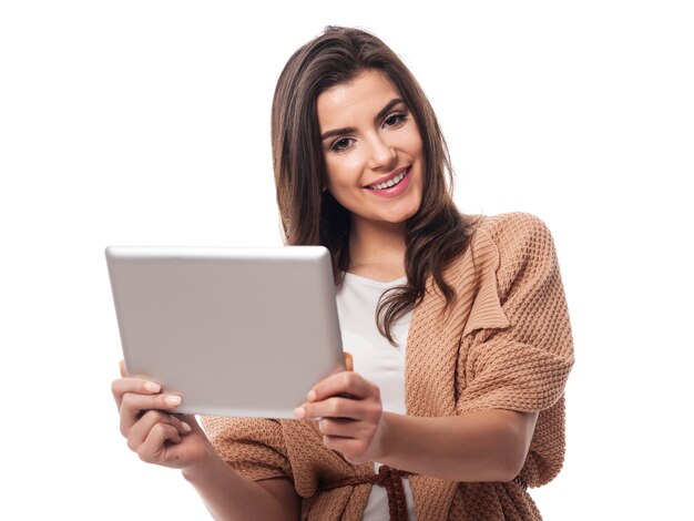 Beautiful woman holding digital tablet