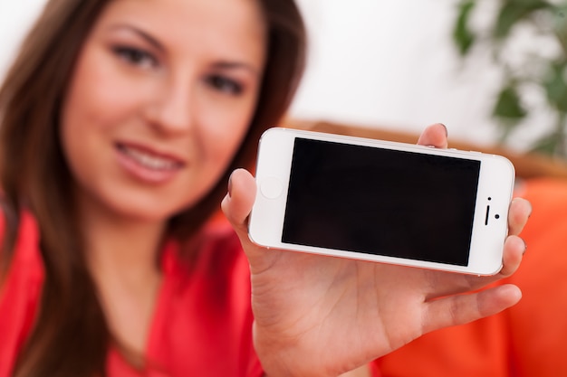 Beautiful woman holding smartphone