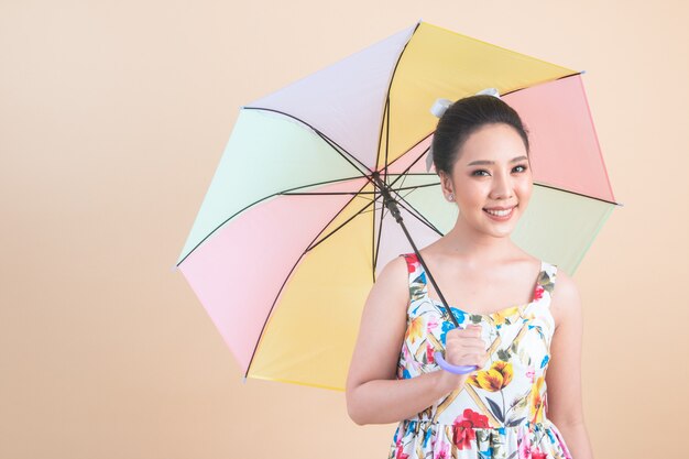 beautiful woman holding a umbrella