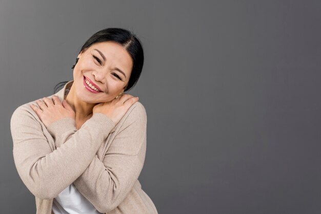 Beautiful woman hugging herself