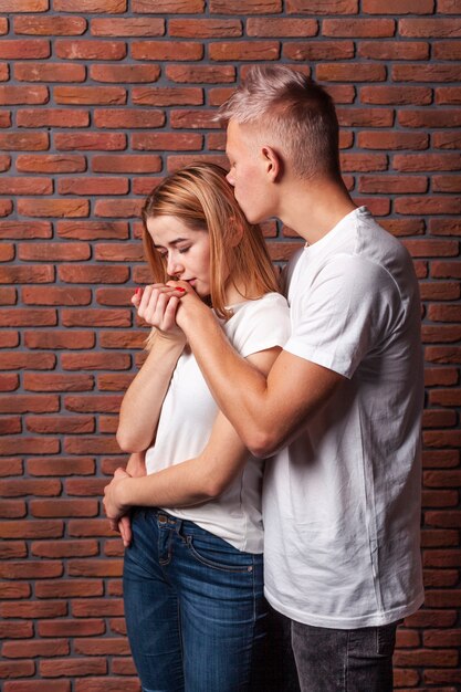 Beautiful woman kissing her boyfriend's hand