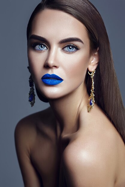 beautiful woman lady with blue lips and jewelry