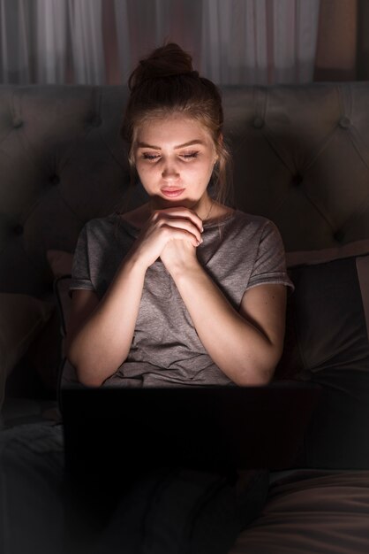 beautiful woman looking at laptop