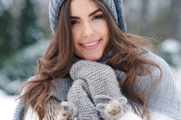 Beautiful woman loving nature during the winter