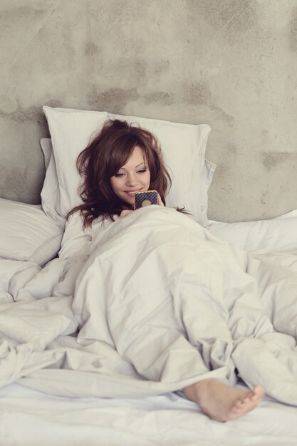 Beautiful woman lying in the bed