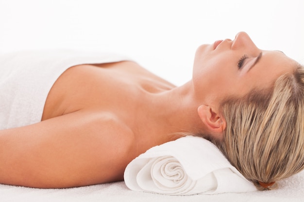 Beautiful woman lying in a spa