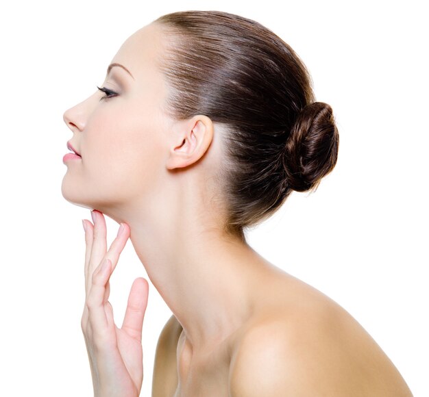 Beautiful woman pampering the neck  - on white background. Profile portrait.