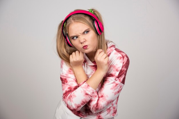 Beautiful woman in pink outfit trying to fight.