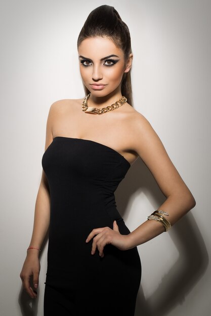 Beautiful woman posing in black dress