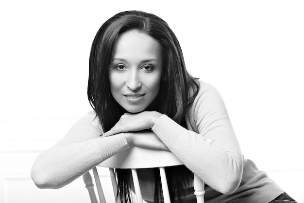 Beautiful woman posing on a chair