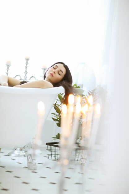 Beautiful woman posing at home in bathroom