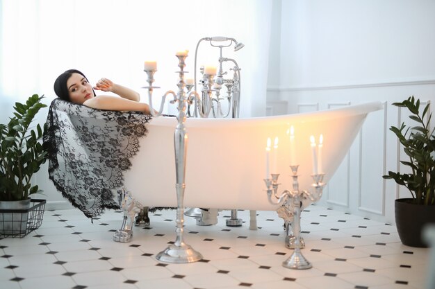 Beautiful woman posing at home in bathroom