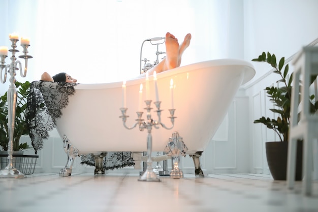 Beautiful woman posing at home in bathroom