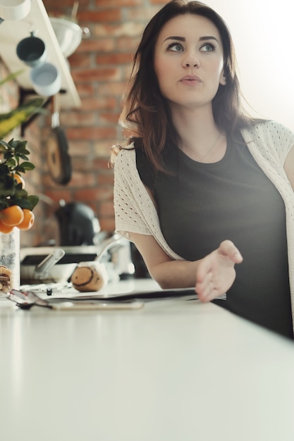 Beautiful woman posing in kitchen