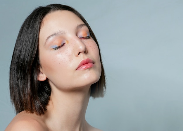 Beautiful woman posing with eyes closed