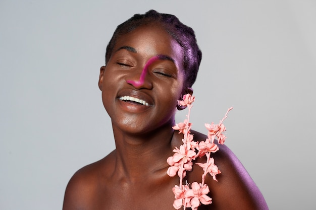 Beautiful woman posing with flower front view