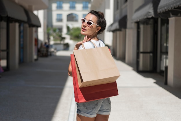 Beautiful woman posing with shopping bags