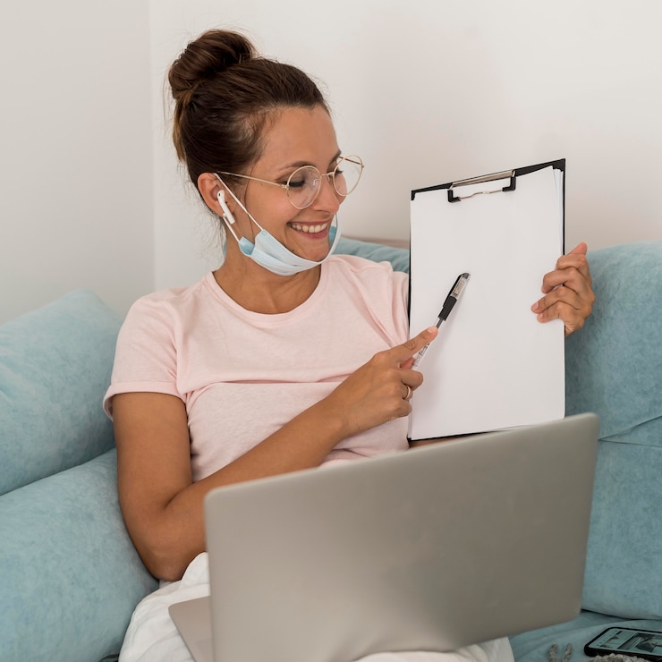 Free Photo beautiful woman presenting project from home