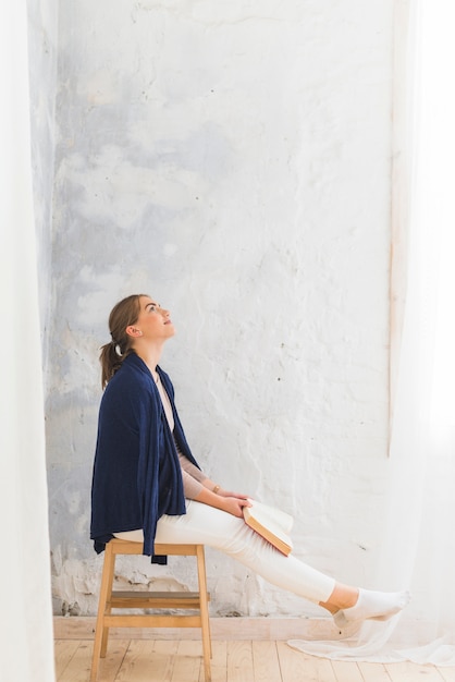 Free photo beautiful woman reading story book