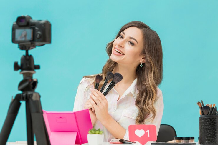 Free Photo beautiful woman recording make-up video