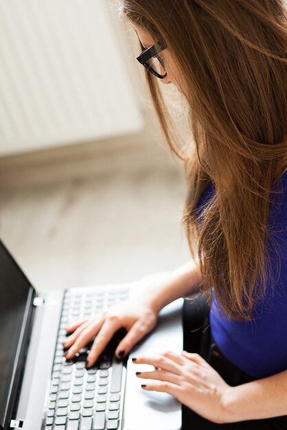 Beautiful woman relaxing with notebook