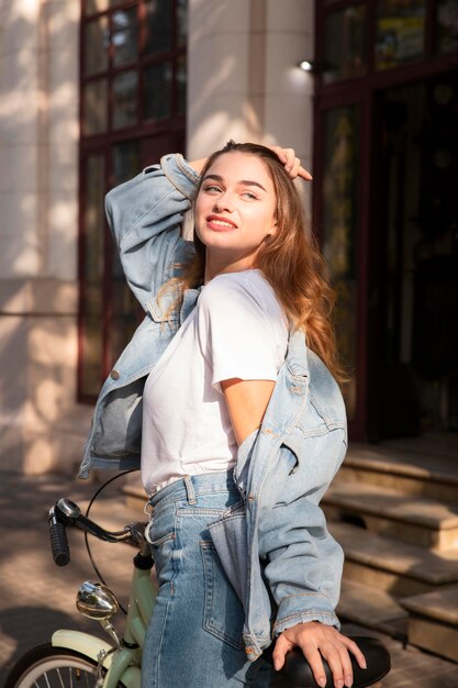 Beautiful woman riding her bike in the city