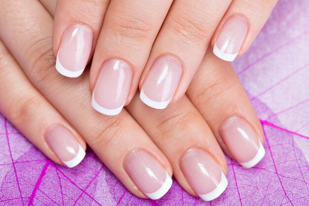 Beautiful woman's nails with beautiful french manicure