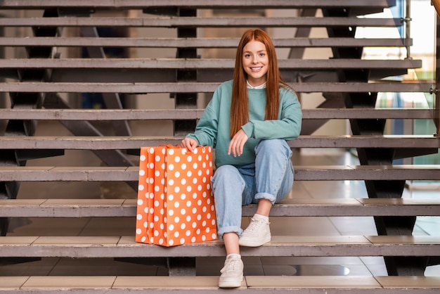 Beautiful woman sitting on stairs