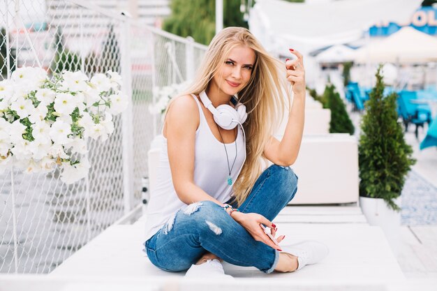 Beautiful woman sitting on table