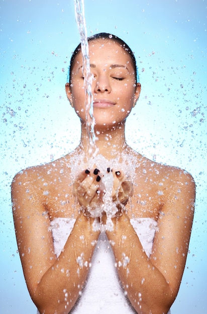 Beautiful woman under splash of water