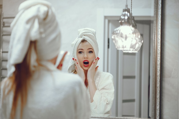 Beautiful woman standing in a bathroom