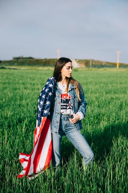 Beautiful woman staying in field