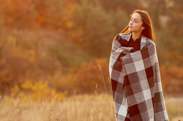 Beautiful woman staying outside with copy space