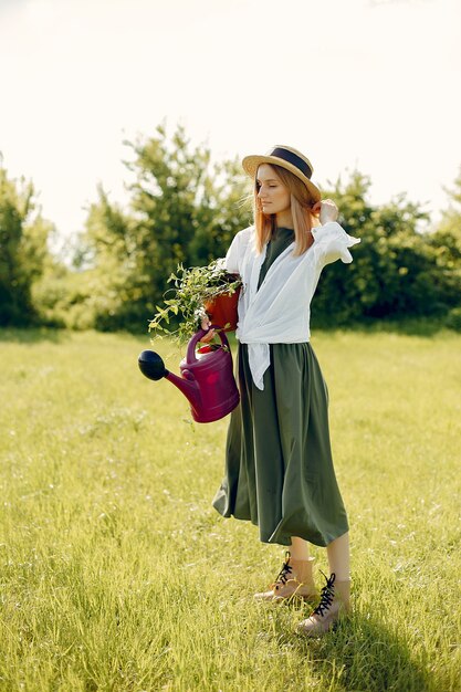 Beautiful woman in a summer field