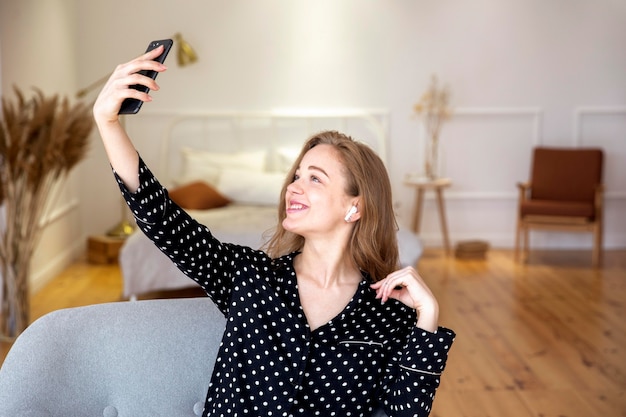 Beautiful woman taking a selfie