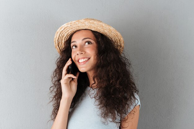 Beautiful woman talking on phone isolated