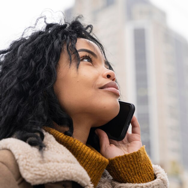 Beautiful woman talking on the phone outside